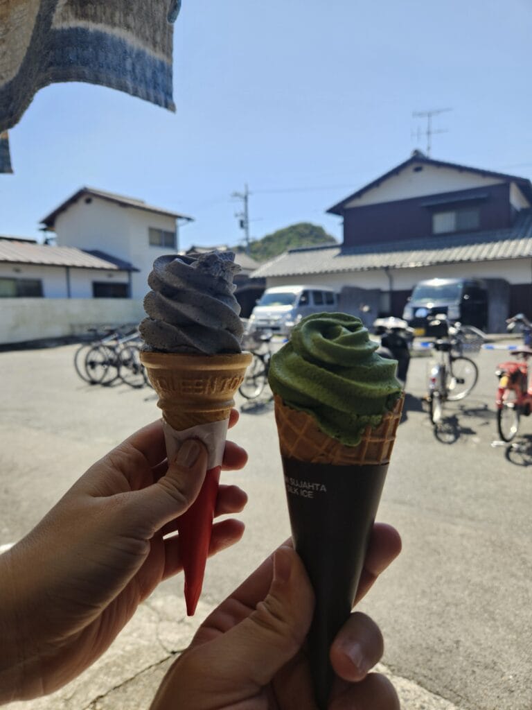 Matcha and black sesame kurogoma soft serve ice cream from Akaitaba cafe on Naoshima island, a popular refreshment for cyclists visiting the Seto Inland Sea art sites.